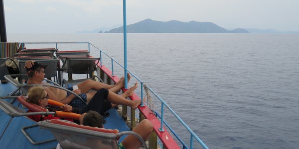 relaxing on deck boat trip mr khai