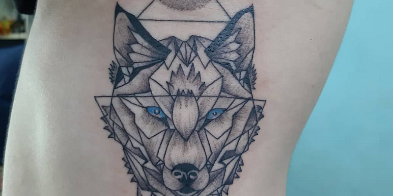 wolf tattoo by boy bamboo tattoo koh chang