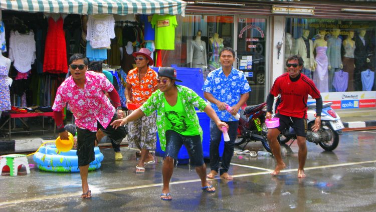 men playing songkran water games